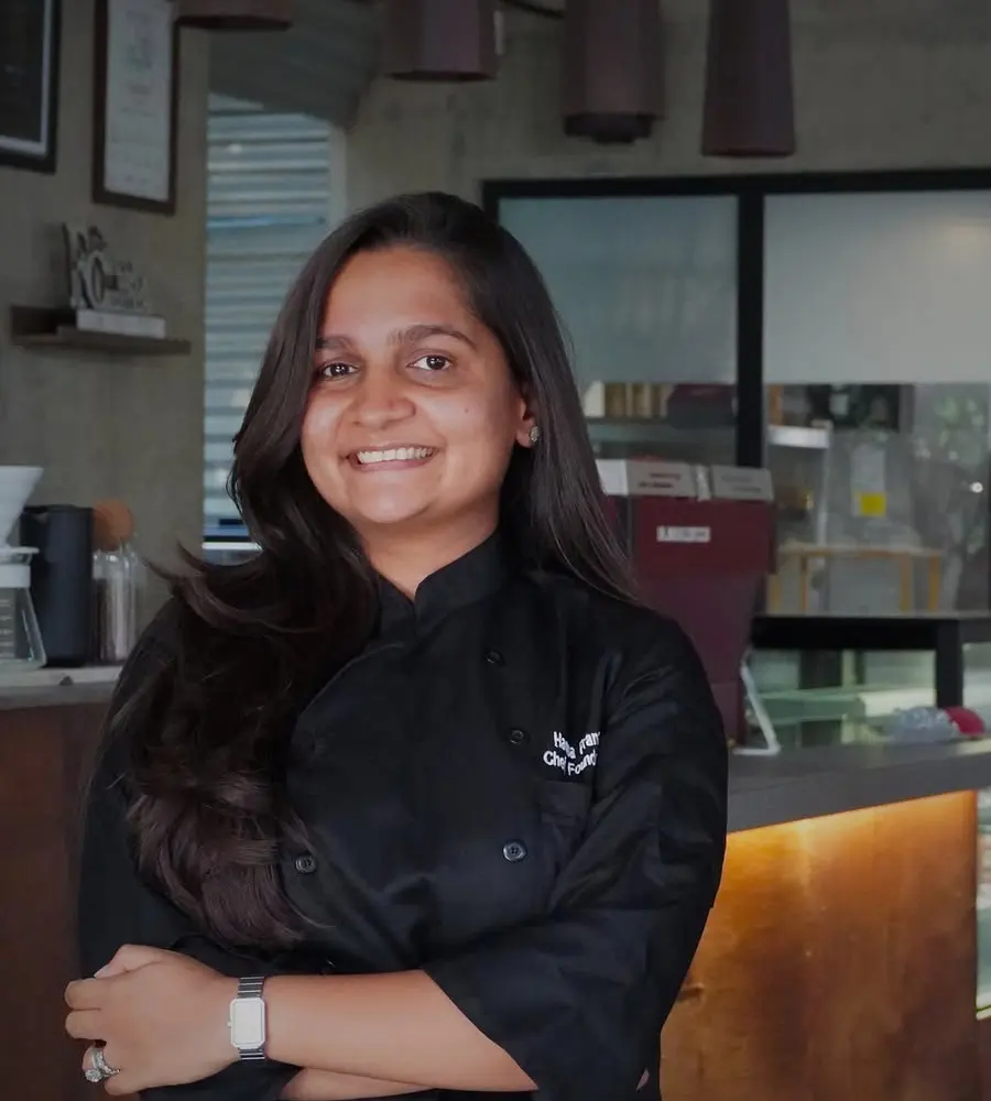 Haena Patel, founder of GRID, standing in the café